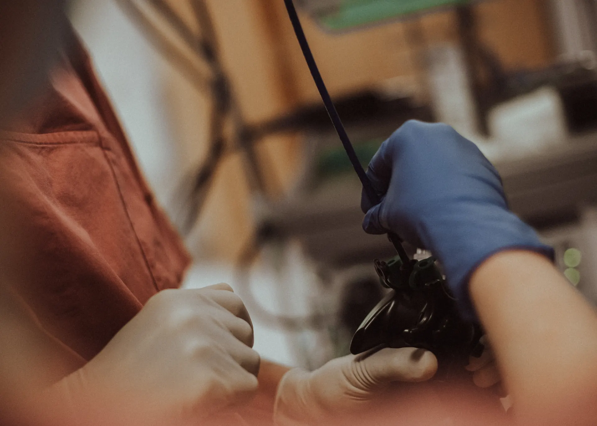 Hands guiding the endoscope during a gastroscopy