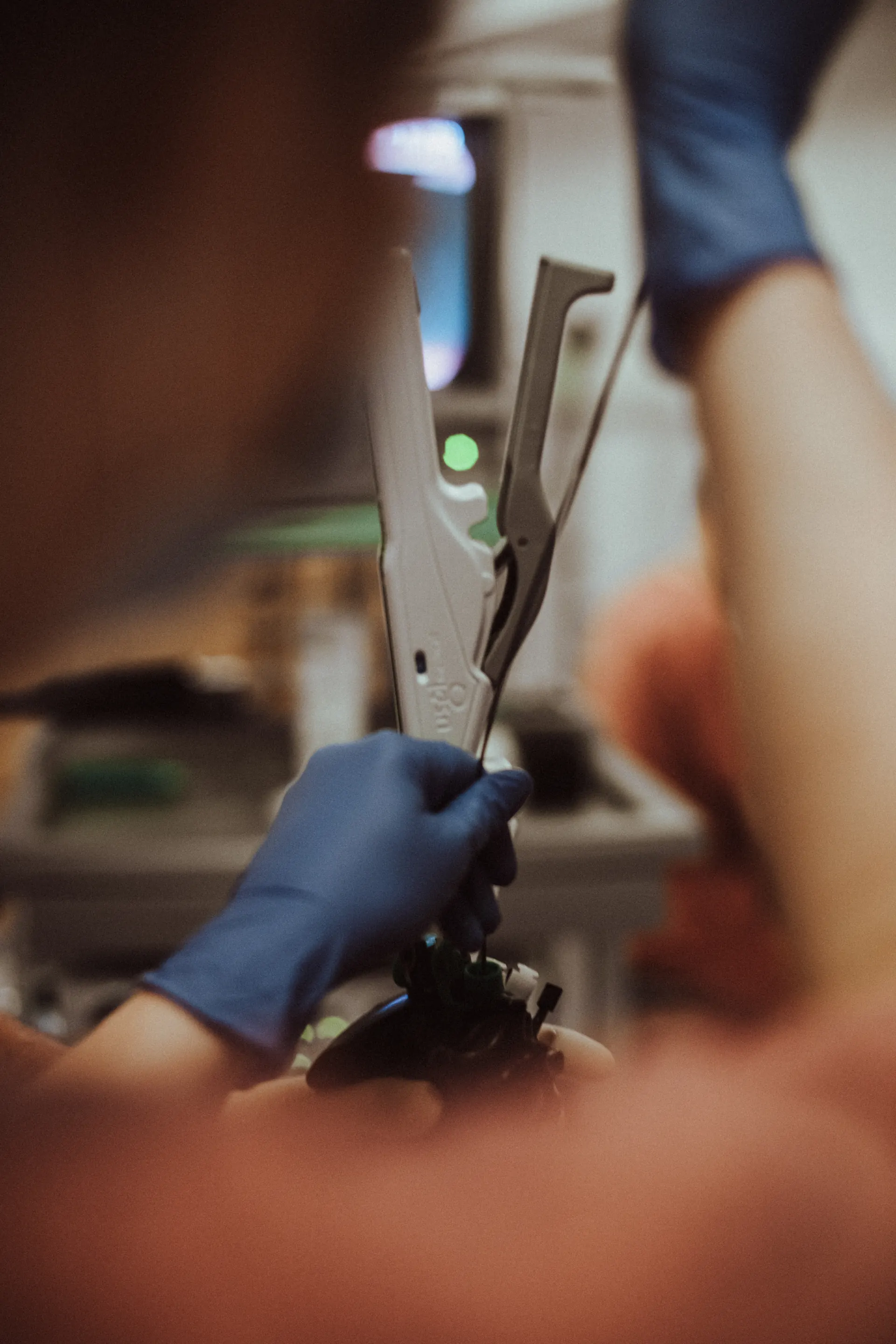 Hands holding the endoscopic suturing instrument for the Weight Doctors SLEEVE®