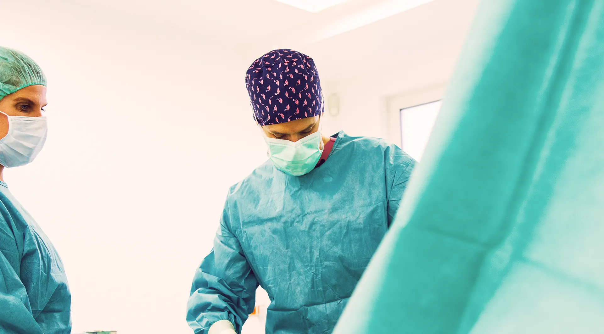 Surgeon and theatre team during liposuction